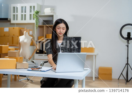 Woman start up online seller owner at workplace. Woman start up online seller owner at workplace. 139714176