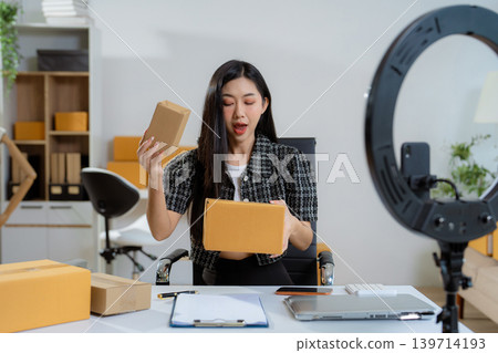 Asian vlogger woman influencer, SME retail store owner smile enjoy selling. Asian vlogger woman influencer, SME retail store owner smile enjoy selling. 139714193