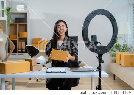 Asian vlogger woman influencer, SME retail store owner smile enjoy selling. Asian vlogger woman influencer, SME retail store owner smile enjoy selling. 139714199
