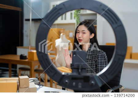 Asian vlogger woman influencer, SME retail store owner smile enjoy selling. Asian vlogger woman influencer, SME retail store owner smile enjoy selling. 139714200