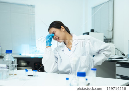 two scientists are under stress from working in research lab. two scientists are under stress from working in research lab. 139714236