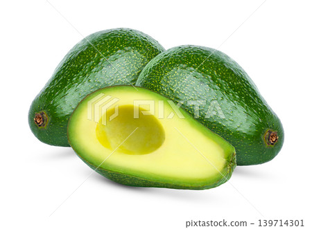 Two green shiny avocados and cut in a half without seed or pit. Fresh avocado and half of avocado with no seed isolated on white. 139714301