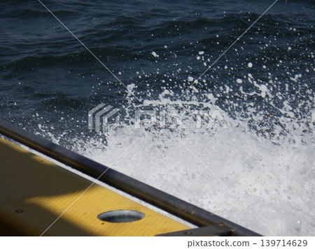 The waves are crashing down hard. The waves are crashing down hard. 139714629