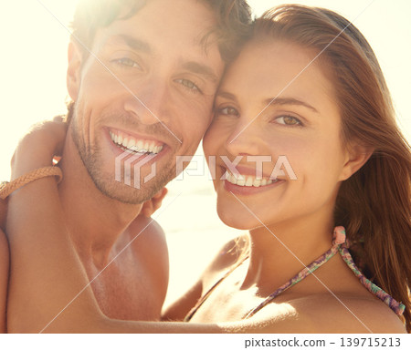 Sunset, portrait and happy couple hug at a beach for summer, adventure or vacation while bonding in nature. Face, smile and people at sea with support, trust and love at sunrise, journey or holiday Sunset, portrait and happy couple hug at a beach for summer, adventure or vacation while bonding in nature. Face, smile and people at sea with support, trust and love at sunrise, journey or holiday 139715213