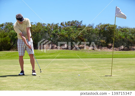 Sport, man and golf on grass outdoor for playing, performance and game with fitness and wellness. Athlete, mature person and golfer with club, ball and exercise on field for recreation, hobby and fun 139715347