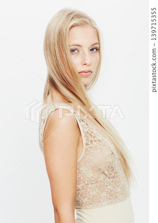 Woman, portrait and blonde in fashion, long hair and stylish clothing on a white studio background. Face of female person or young attractive model with makeup in lace dress or T shirt on mockup 139715355