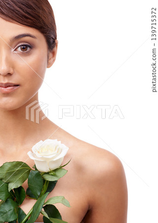 Woman, rose and beauty with half portrait, vegan and model for skincare cosmetics on white background. Makeup, wellness treatment or mockup with shine, flower or organic for glow with healthy skin Woman, rose and beauty with half portrait, vegan and model for skincare cosmetics on white background. Makeup, wellness treatment or mockup with shine, flower or organic for glow with healthy skin 139715372