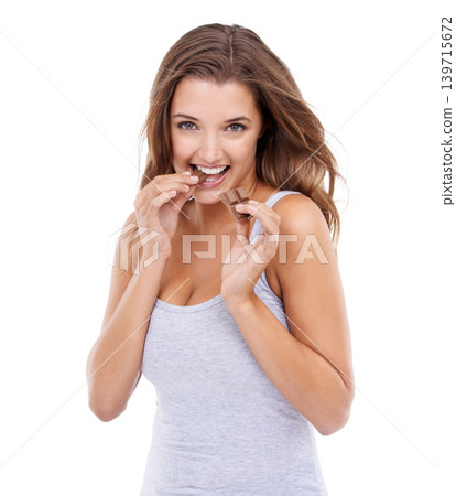 Woman, bite chocolate and portrait with candy, sweet tooth and pleasure for craving sugar in studio background. Hungry, snack and meal for comfort, dessert and sweets for calories, diet and treat Woman, bite chocolate and portrait with candy, sweet tooth and pleasure for craving sugar in studio background. Hungry, snack and meal for comfort, dessert and sweets for calories, diet and treat 139715672