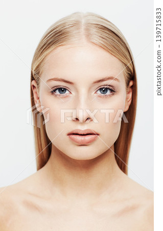 Portrait, woman and beauty or cosmetic in studio, confident and cosmetology for facial skin treatment. Young model, face and shine in self care or blonde hair and organic makeup by white background 139715833