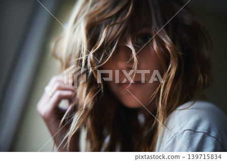 Portrait, beauty and hair with woman in home, closeup to relax on dark morning of weekend. Face, skincare and aesthetic with young person alone in apartment for natural hair care or cosmetics Portrait, beauty and hair with woman in home, closeup to relax on dark morning of weekend. Face, skincare and aesthetic with young person alone in apartment for natural hair care or cosmetics 139715834