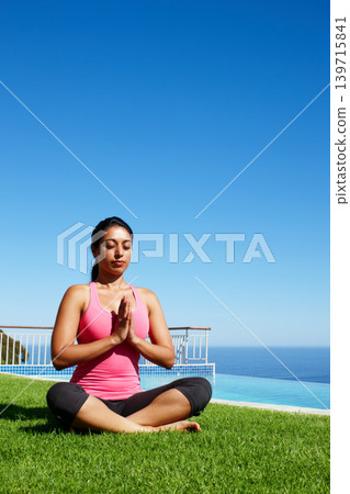 Meditation, yoga and woman on grass by water for holistic fitness, mindfulness and breathing exercise. Faith, hands in prayer and person by ocean for wellness, health and zen energy outdoors Meditation, yoga and woman on grass by water for holistic fitness, mindfulness and breathing exercise. Faith, hands in prayer and person by ocean for wellness, health and zen energy outdoors 139715841