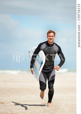Surfer, man with surfboard and running on beach for extreme sports, wet suit and adventure in the sun. Summer vacation with adventure and surfing in nature, ocean and exercise with hobby in Australia Surfer, man with surfboard and running on beach for extreme sports, wet suit and adventure in the sun. Summer vacation with adventure and surfing in nature, ocean and exercise with hobby in Australia 139716135