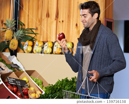 Apple, food or happy man shopping at a supermarket for grocery promotions, sale or discounts deal. Check, fresh or customer buying groceries for healthy nutrition, organic fruits or diet with choice 139716138