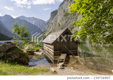 Small boathouse at lake Obersee, lake Konigssee, in the Berchtesgaden Alps, Bavaria, Germany Small boathouse at lake Obersee, lake Konigssee, in the Berchtesgaden Alps, Bavaria, Germany 139716907