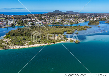 Aerial view of Wallis Lake in Forster NSW Australia. Drone photograph captures the expansive lake system, clear waterways and surrounding coastal landscape Aerial view of Wallis Lake in Forster NSW Australia. Drone photograph captures the expansive lake system, clear waterways and surrounding coastal landscape 139717427