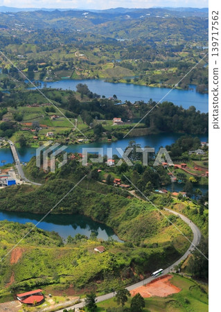 The breathtaking scenery and emerald green waters of Lake Guatapé, a hidden gem in Colombia, South America. The breathtaking scenery and emerald green waters of Lake Guatapé, a hidden gem in Colombia, South America. 139717562