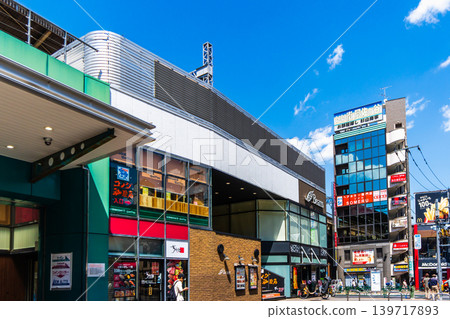 Tokyo, Chuo Line, Asagaya Station: Early summer blue sky and view of the area in front of the south exit of the station. Tokyo, Chuo Line, Asagaya Station: Early summer blue sky and view of the area in front of the south exit of the station. 139717893