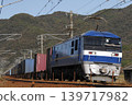 A freight train pulled by an EF210 locomotive running on the Sanyo Main Line. 139717982