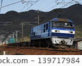 A freight train pulled by an EF210 locomotive running on the Sanyo Main Line. 139717984
