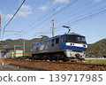 A freight train pulled by an EF210 locomotive running on the Sanyo Main Line. 139717985
