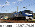 A freight train pulled by an EF210 locomotive running on the Sanyo Main Line. 139717986