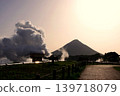 Mount Kaimon at dusk, with plumes of smoke billowing out. 139718079
