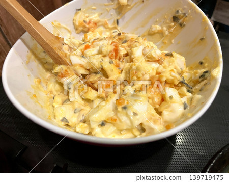 Cucumber and egg salad with mayonnaise dressing Cucumber and egg salad with mayonnaise dressing 139719475