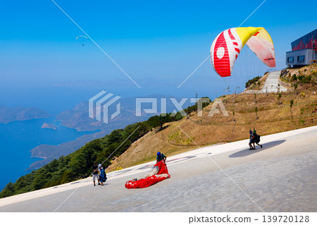 Flying paraglider at Babadag mountain in Turkey Flying paraglider at Babadag mountain in Turkey 139720128