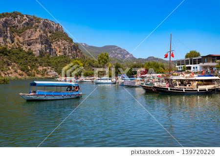 Boats at Dalyan river in Dalyan town, Turkey Boats at Dalyan river in Dalyan town, Turkey 139720220