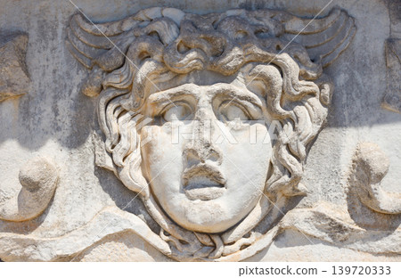 A stone carved Medusa head at the Temple of Apollo at Didyma in Didim 139720333