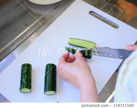 Shred the cucumber with a Santoku knife Shred the cucumber with a Santoku knife 139721500