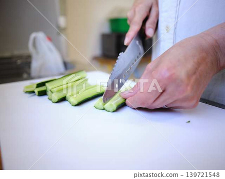 Shred the cucumber with a Santoku knife 139721548