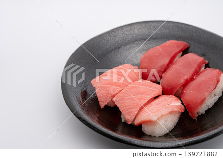 Tuna nigiri sushi served on a black plate Tuna nigiri sushi served on a black plate 139721882