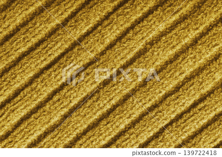 Yellow colored knitted fabric, knitwear texture with diagonal soft ribbed pattern background Yellow colored knitted fabric, knitwear texture with diagonal soft ribbed pattern background 139722418