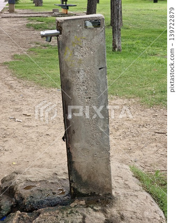 Sarmiento Park, Cordoba, Argentina - April 11, 2026: Public drinking water fountain with flowing water Sarmiento Park, Cordoba, Argentina - April 11, 2026: Public drinking water fountain with flowing water 139722879