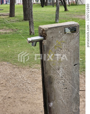 Sarmiento Park, Cordoba, Argentina - April 11, 2026: Close up of water filling the basin of a public drinking fountain Sarmiento Park, Cordoba, Argentina - April 11, 2026: Close up of water filling the basin of a public drinking fountain 139722880