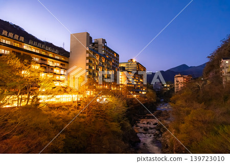 The massive hotel complex towering upstream of Kurogane Bridge in Nikko City, Tochigi Prefecture, and the blue hour at Kinugawa Onsen. The massive hotel complex towering upstream of Kurogane Bridge in Nikko City, Tochigi Prefecture, and the blue hour at Kinugawa Onsen. 139723010
