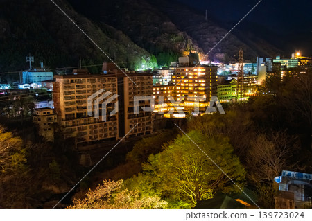 Nikko City, Tochigi Prefecture: The lights from the windows of a huge hotel complex and the nighttime streetscape of Kinugawa Onsen. Nikko City, Tochigi Prefecture: The lights from the windows of a huge hotel complex and the nighttime streetscape of Kinugawa Onsen. 139723024