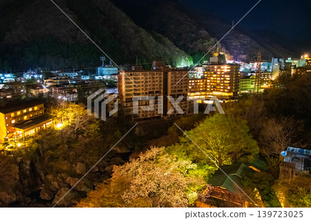 Nikko City, Tochigi Prefecture: The lights from the windows of a huge hotel complex and the nighttime streetscape of Kinugawa Onsen. Nikko City, Tochigi Prefecture: The lights from the windows of a huge hotel complex and the nighttime streetscape of Kinugawa Onsen. 139723025