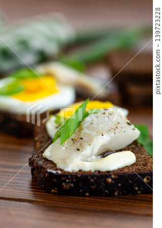 Traditional fish appetizer with egg and green onion 139723228