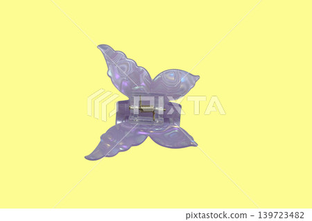 Plastic butterfly shaped hair clip. 139723482