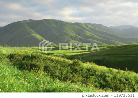 summer landscape with mountain slopes and cloudy sky summer landscape with mountain slopes and cloudy sky 139723531