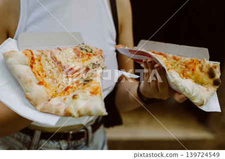 Girl with delicious Italian pizza in her hands. Girl with delicious Italian pizza in her hands. 139724549