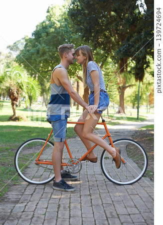 Romance, love and couple on bicycle journey, outdoor wellness and romantic date in nature. Travel, care and people cycling for bonding activity, transportation and connect with partner on bike ride Romance, love and couple on bicycle journey, outdoor wellness and romantic date in nature. Travel, care and people cycling for bonding activity, transportation and connect with partner on bike ride 139724694