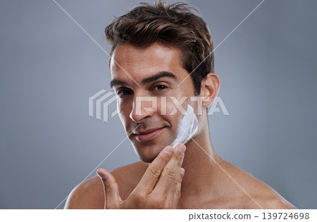 Portrait, shave cream and man with skincare, cosmetics and beauty on a grey studio background. Face, person and model with grooming routine and treatment with beard and moisture with wellness 139724698
