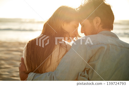 Love, sunset and beach couple relax with summer sunshine, wellness and bonding on travel holiday in Greece. Forehead touch, romance and back of man, woman or people connect with devotion to soulmate Love, sunset and beach couple relax with summer sunshine, wellness and bonding on travel holiday in Greece. Forehead touch, romance and back of man, woman or people connect with devotion to soulmate 139724793