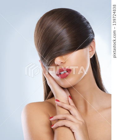 Hair, salon and hands of woman with manicure in studio on white background for keratin treatment. Face, beauty and nails with confident young haircare model for shampoo, cosmetics or hairdressing Hair, salon and hands of woman with manicure in studio on white background for keratin treatment. Face, beauty and nails with confident young haircare model for shampoo, cosmetics or hairdressing 139724838