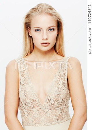 Portrait, model and confident in lingerie in studio, beauty and feminine fashion with body care. Young woman, face and cosmetics in underwear for skincare, blonde hair and make up by white background Portrait, model and confident in lingerie in studio, beauty and feminine fashion with body care. Young woman, face and cosmetics in underwear for skincare, blonde hair and make up by white background 139724841