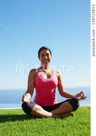 Meditation, yoga and portrait of woman on grass for holistic fitness, mindfulness and breathing exercise. Relax, lotus pose and person by ocean for wellness, health and zen energy outdoors Meditation, yoga and portrait of woman on grass for holistic fitness, mindfulness and breathing exercise. Relax, lotus pose and person by ocean for wellness, health and zen energy outdoors 139724853