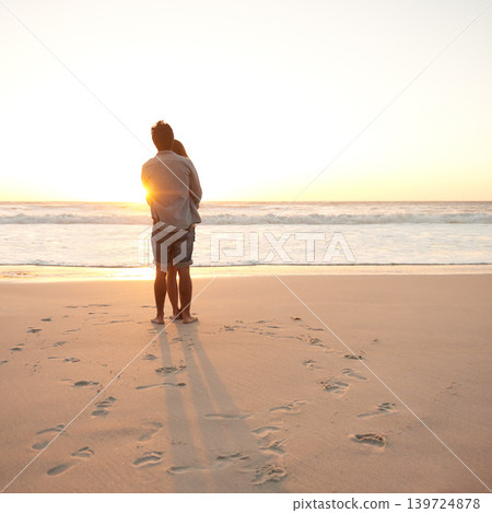 Man, woman and beach embrace at sunset or summer travel or adventure, bonding or marriage. Happy couple, love and sea hug for dating tourism or back view at nature vacation, environment or holiday Man, woman and beach embrace at sunset or summer travel or adventure, bonding or marriage. Happy couple, love and sea hug for dating tourism or back view at nature vacation, environment or holiday 139724878